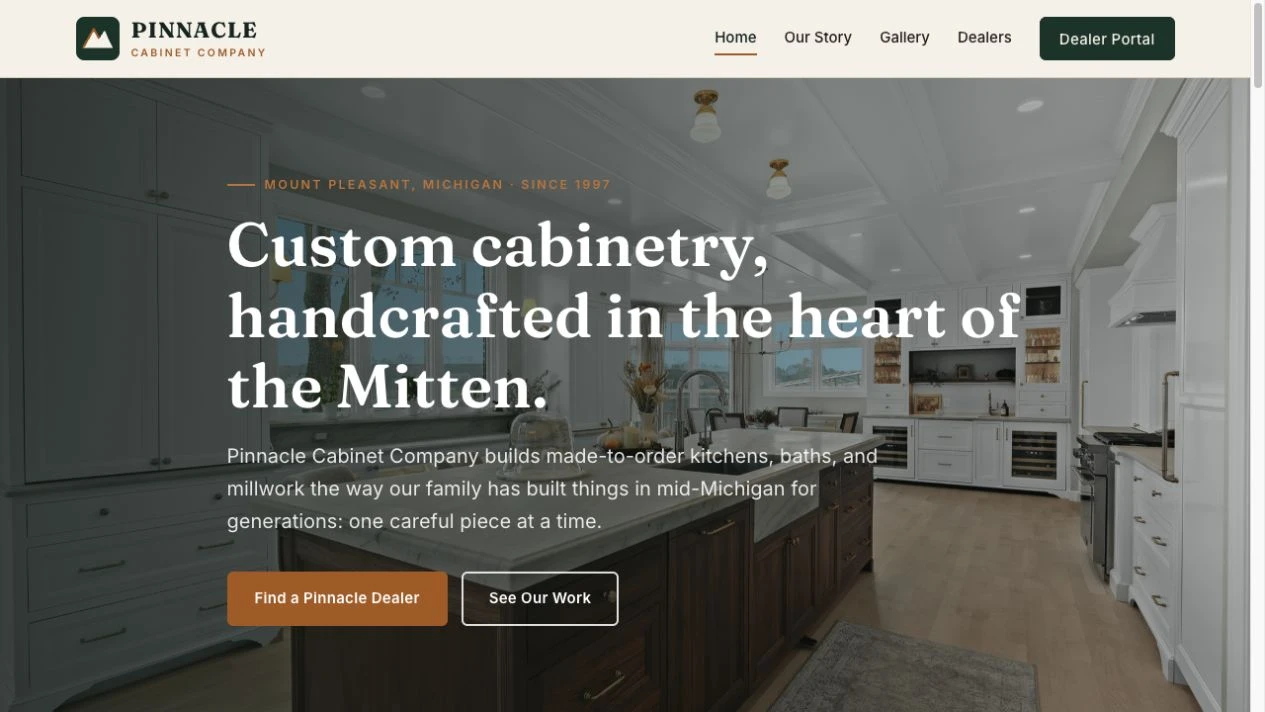 Pinnacle Cabinet Company concept homepage, with a custom kitchen photograph and cabinetry headline